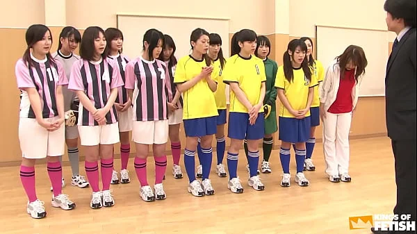 Japanese female team listen and take a lesson from their coach